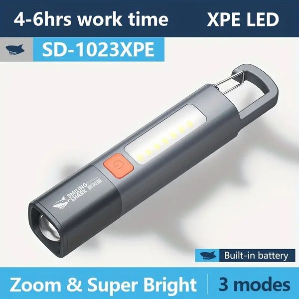 Tubarão sorridente SD1023 LED Lanterna XPE Lanterna super brilhante com Gancho Luz de acampamento USB recarregável Zoomable à prova d'água ao ar livre para caminhadas domésticas de emergência