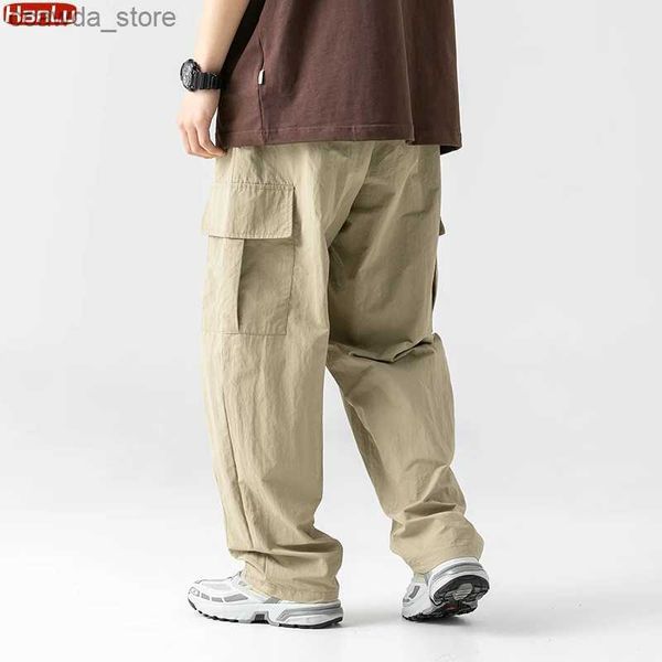 Calças masculinas primavera verão 2023 novas calças de carga multi-bolso masculino casual cor sólida em linha reta baggy calças largas masculino q240104