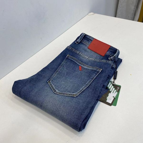 Designer de moda Menswear designer denim placa de identificação de couro fino perna reta jeans de alta qualidade rasgado motocicleta slim fit para homens e mulheres calças de motocicleta