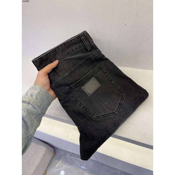 Primavera e verão novo designer jeans moda confortável material de algodão força elástica simples preto luxo casual para homem