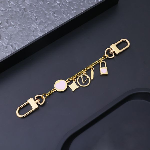 Portachiavi con fibbia a doppia testa in lega di lusso Catene d'oro Portachiavi con ciondolo floreale in metallo Designer Love Lock Uomo Donna Coppia Lettere Portachiavi