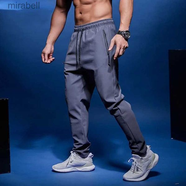 Pantaloni da uomo Nuovi uomini Pantaloni da corsa Pantaloni da allenamento per calcio con tasca con cerniera Calcio Jogging Palestra Pantaloni fitness Allenamento Pantaloni sportivi YQ240108