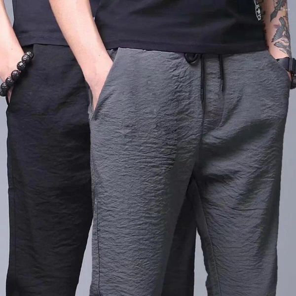 Pantaloni da uomo allenamento di uomini magri leggings tasche fresche eleganti pantaloni dritti