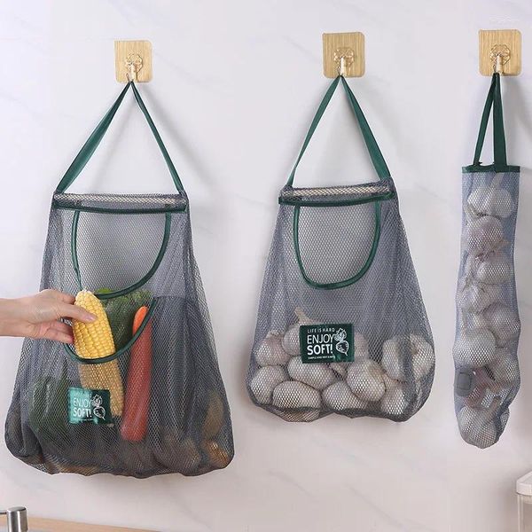 Sacos de armazenamento Cozinha multifuncional pendurado saco de frutas vegetais mão para segurar gengibre alho cebola escavada respiração