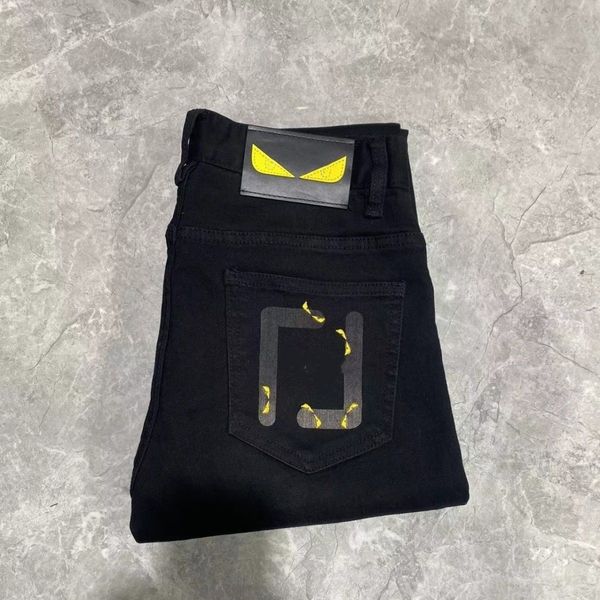 Stilista di moda uomo Primavera Estate Hole slim fit per uomo e donna lettera occhi in metallo Targhetta in pelle pantaloni sportivi casual da strada retrò pantaloni da jogging