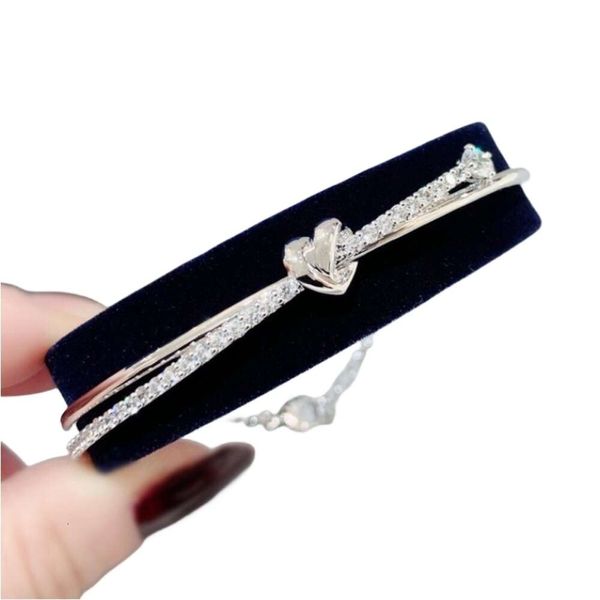 Swarovskis Armband Designer Damen Top Qualität Armreif Geliebtes brillantes Liebesknoten Armband für Damen Element Kristall Herzförmiges Armband für Damen