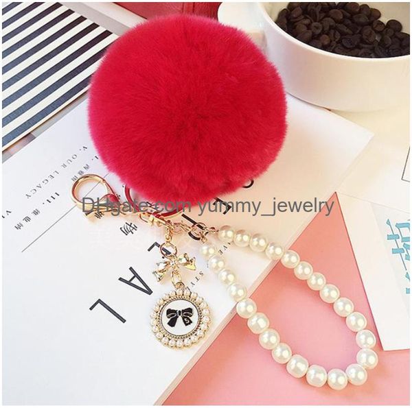 Catena di perle di moda Fiocco di cristallo Pompon Portachiavi Auto Borsa da donna Portachiavi Fluffy Puff Ball Portachiavi Gioielli Drop Delivery Dhdbs