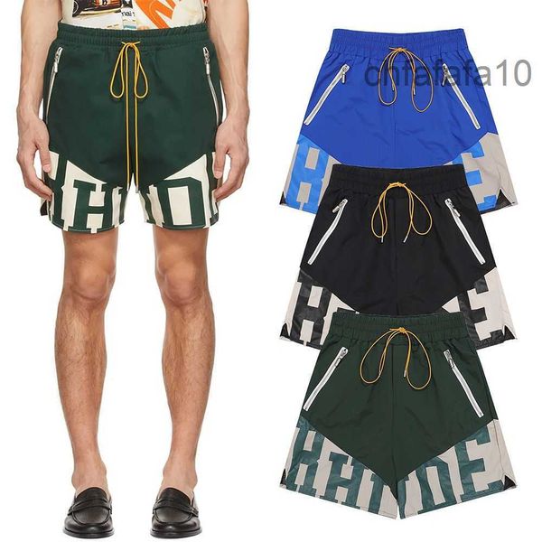 Rhude Mans Shorts Diseñador de verano Moda de lujo Empalme Contraste Pantalones de relajación Mujer Ropa de calle Azul Negro Corto para hombre Tamaño europeo y americano s m l x 17RX