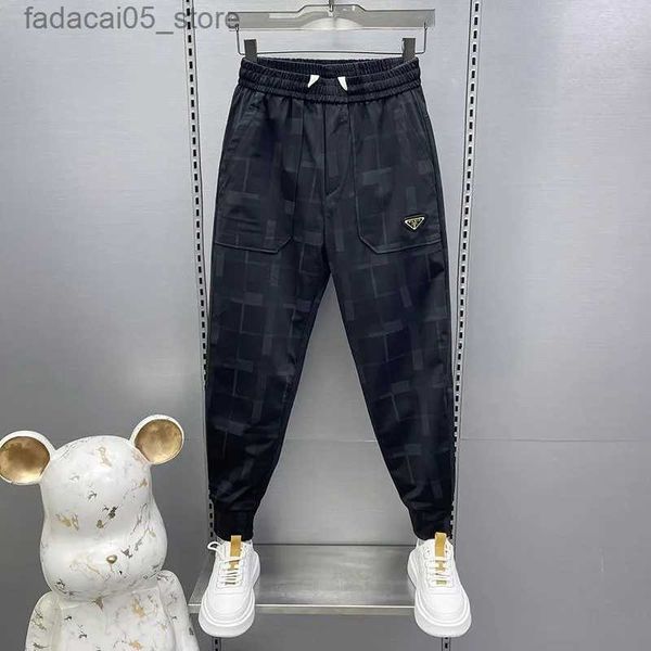 Calças masculinas primavera e outono na moda padrão xadrez streetwear preto harem calças de alta qualidade jogger sweatpants moda marca casual calças q240117