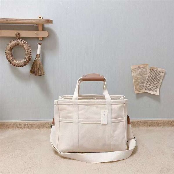 Koreanische Instagram modische multifunktionale Mutter und eine Schulter Umhängetasche Handheld Canvas Baby Kinderwagen Mama Tasche