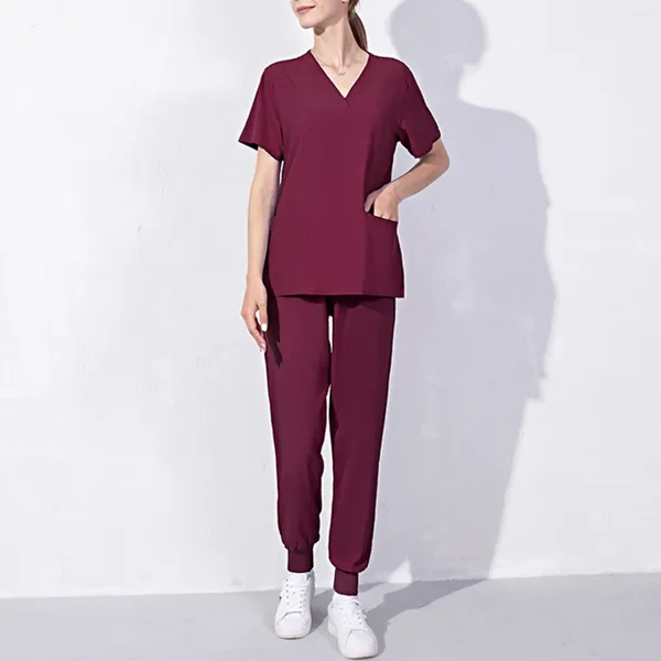 Pantaloni a due pezzi da donna Abiti Scrub moda Scrub Set per donna Pantaloni da jogging Top Uniforme infermieristica con scollo a V Tinta unita Abbigliamento da lavoro