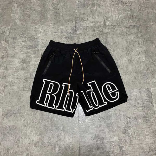 Abbigliamento firmato Rhude Lettera Pantaloni da spiaggia riflettenti Cerniera casual Pantaloncini larghi da donna da uomo Coppie Jogging Abbigliamento sportivo Fitness Outdoor VJK7