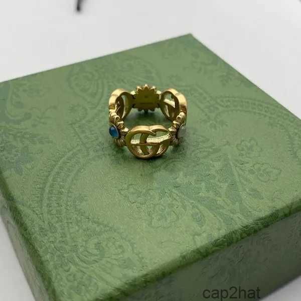 Anello di design Modello di fiore dorato Amore Anelli di lusso Diamante blu Moda Donna Gioielli Uomo Brillante Lettera G con scatola T64C