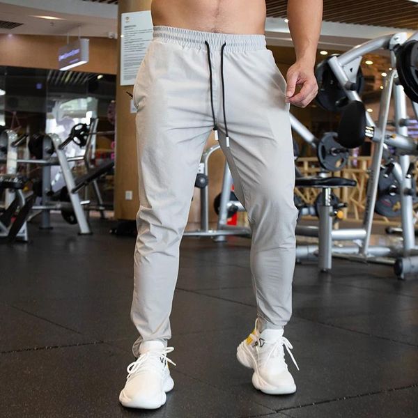 Pantolon Sonbahar Erkekler Pantolon Çalışıyor Elastik Gevşek Düz Eğitim Fitness Joggings Fermuar ayak bileği açık su geçirmez hızlı kuru spor salonu pantolon