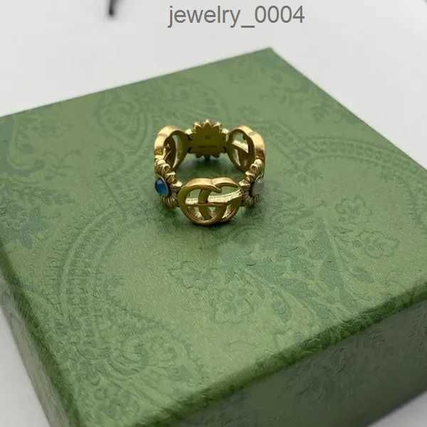 Anello di design Modello di fiore dorato Amore Anelli di lusso Diamante blu Moda Donna Gioielli Uomo Brillante Lettera G Con scatola WIV6