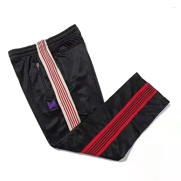 Pantaloni da uomo AWGE Y2K NEEDLES Farfalla Ricamo Logo Pantaloni rossi a righe con fettuccia Cerniera nera Uomo Donna