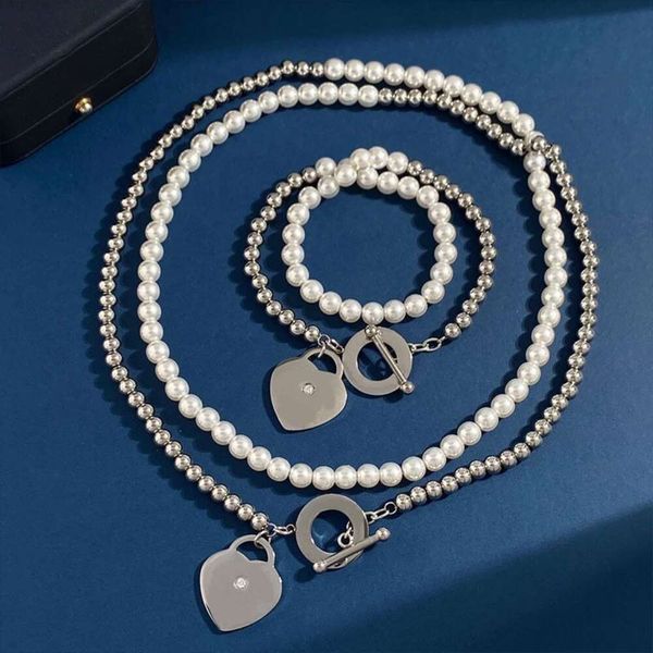 Colar de joias Tiffanie de designer em aço de titânio em forma de coração com fivela de diamante único colar com selo de aço design de pulseira com estilo pérola de camada dupla