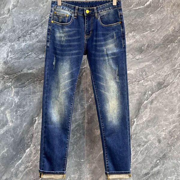 jeans da uomo di fascia alta firmati Jeans da uomo moda donna lettere verdi pantaloni grafici ricamati pantaloni classici larghi in vitello