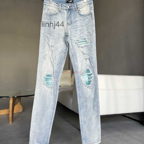Jeans da uomo Designer Abbigliamento Amires Pantaloni denim Amies 2023 New Light Blue Wash Water Bright Patch Hole Breaking Elastic Slim Fit sZW7Y