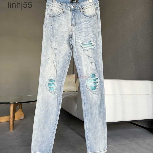 Jeans masculinos designer roupas amires denim calças amies 2023 nova luz azul lavagem água brilhante remendo buraco quebrando elástico fino ajuste syj51