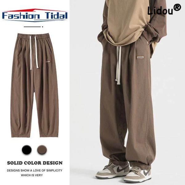 Pantaloni Moda Vita con cordino Adesivi Pantaloni sportivi da uomo Nuova tasca allentata Cilindro dritto Ragazzo casual Senso del design Pantaloni maschili 2023