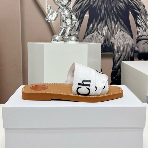 24SS Tasarımcı Sandalet Summer Woodys Düz Katırlar Kadın Terlik Tasarımcı Ayakkabı Tuval Kauçuk Dokuma Ahşap Sandalet Roman Moda Lady Açık Slip Slip Plaj Slaytları