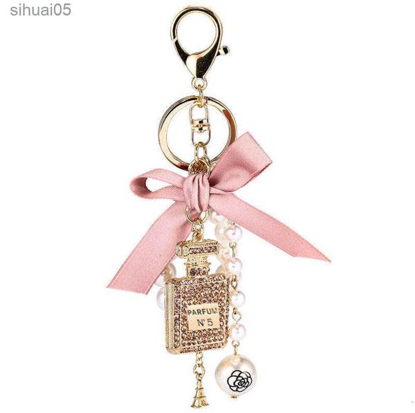 Chiave di moda imitazione perla bottiglia di profumo portachiavi portachiavi carino fiocco chiave portachiavi creativi G1019 240303