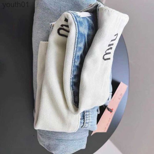 Jeans femininos novos jeans perna reta calças de cintura baixa miu rolo cintura bordado calças de designer olhar fino e cobrir seus quadris 240304