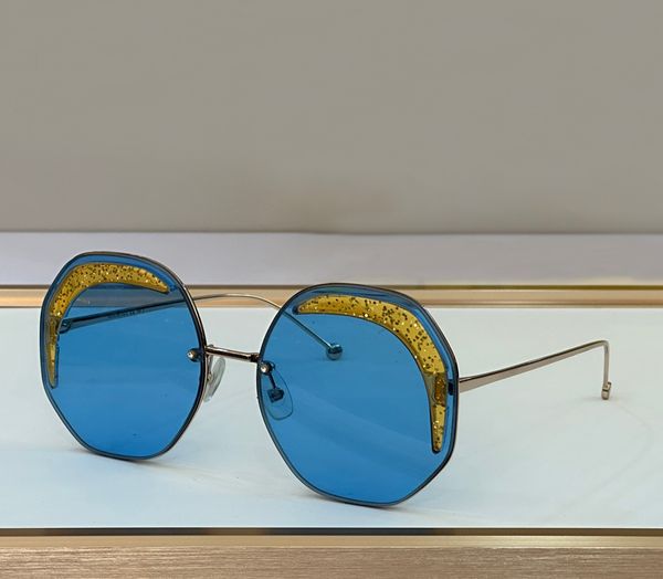 Occhiali da sole rotondi senza montatura Lenti blu oro Occhiali da sole estivi da donna Sonnenbrille Tonalità moda UV400 Occhiali unisex