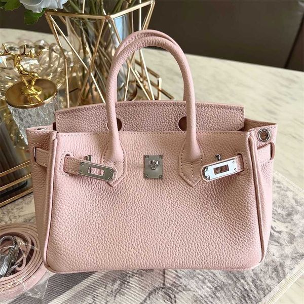 70% Factory Outlet Off Mini borsa a mano in pelle bovina con strato superiore in grana litchi Borsa con bottone in argento in pelle premium Borsa a tracolla da donna in pelle premium in vendita