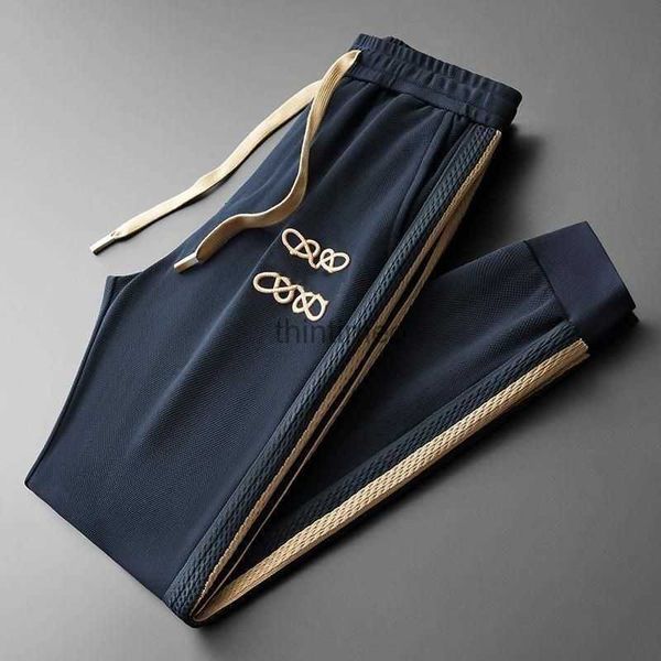 Calças masculinas calças de alta qualidade calças de designer outono calças de renda homens mulheres lado listrado jacquard calças de malha calças de moletom ao ar livre 240308