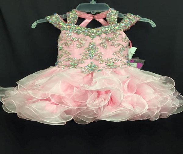 2016 Vestidos de concurso infantil rosa com alças de contas e saias em camadas Imagens reais Cristais Strass Organza Cupcake Girls Pag1399655