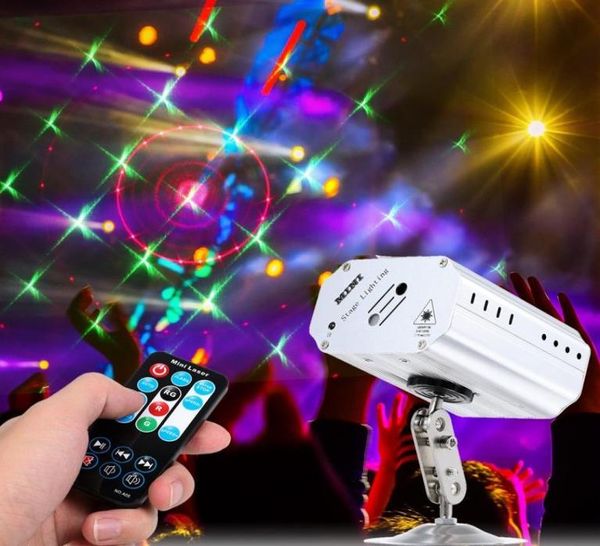 Mini proiettore laser portatile a LED Luci da palco Lampada con effetto ad attivazione vocale automatica per discoteca DJ KTV Festa a casa Natale36989084331918