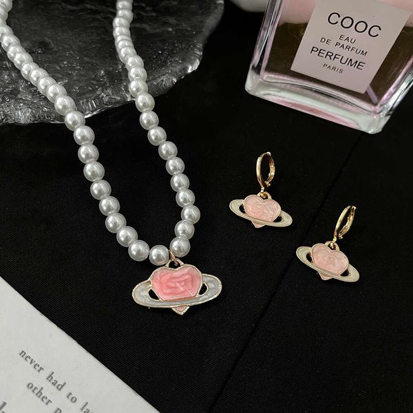 Viviennes Westwoods Schmuck Tropfenglasur Pink Love Planet Perlenkette Weibliches Herz Schöne Mode Ohrringe