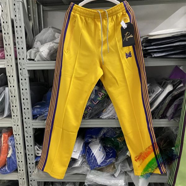 Pantaloni aghi gialli binari pantaloni uomini donne di alta qualità poli morbidi logo logo knitting a strisce viola pantaloni