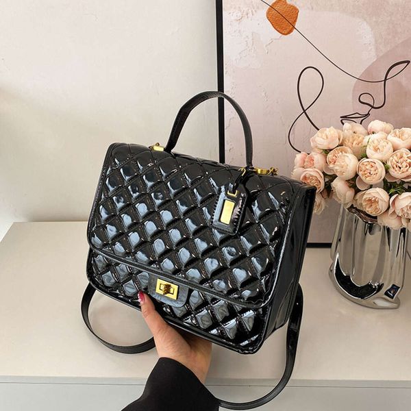 Shop -Handtasche Promotion Koreanische Version Xiaoxiangfeng Rucksack 2024 Sommer Neue Frauenbeutel Patentleder glänzend Kaviar Muster Schulter Trend