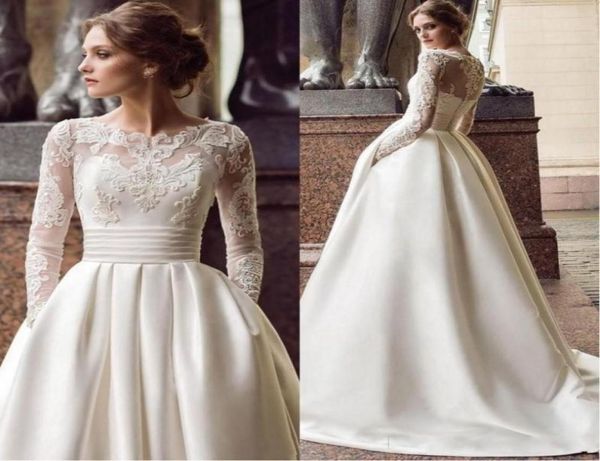 2020 Nuovo design A Line Abiti da sposa Collo trasparente Maniche lunghe Applicazioni in pizzo Raso con perline Con tasche Sweep Train Plus Size Brid8062616