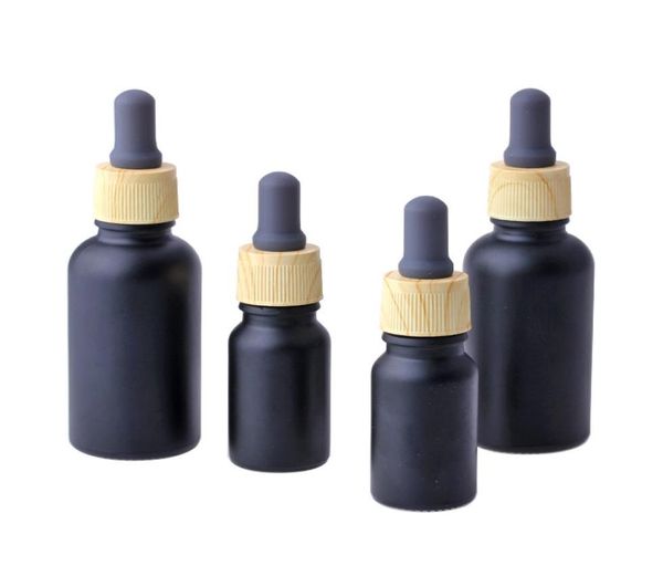 Mattschwarze Glas-E-Liquid-Parfümflasche für ätherische Öle mit Reagenzpipette und Holzmaserungskappe 1030 ml2319667