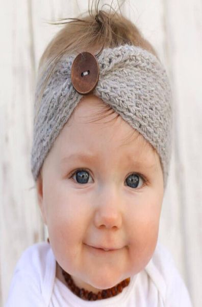 Neue handgemachte Baby stricken häkeln Stirnband Mode Jungen Mädchen Stirnbänder Ohrwärmer mit Knopf Kinder Haarschmuck2927164