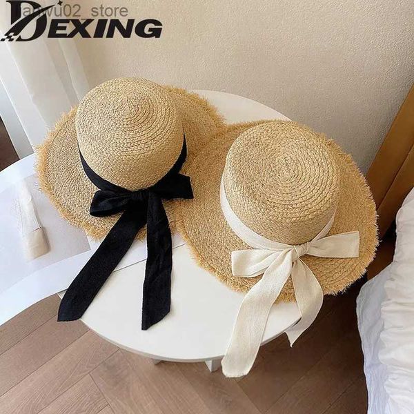 Cappelli a tesa larga Cappelli a secchiello Corea Rafia naturale Cappello largo Birm Cappello da sole Casual quotidiano Cappello di paglia Falt Nero Fiocco bianco Tessuto blocco UV Cappello da spiaggia Vacanza Panama Q240312