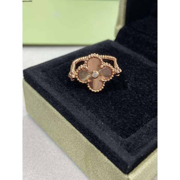 Doppelseitiges Designer-Geschenk für Frau, V-Gold, neuer rotierender Ring mit vierblättrigem Blumenmotiv, rote Jade-Medaille, Chico geschnitzt, 0vg1