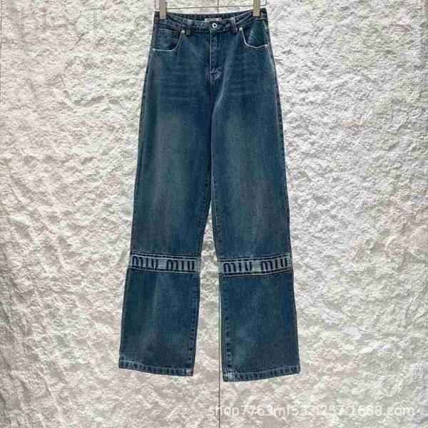 Calça jeans feminina designer 24 primavera / verão nova emenda carta bordado calças jeans com pedra de fermento moagem e tecnologia de branqueamento design SLZY