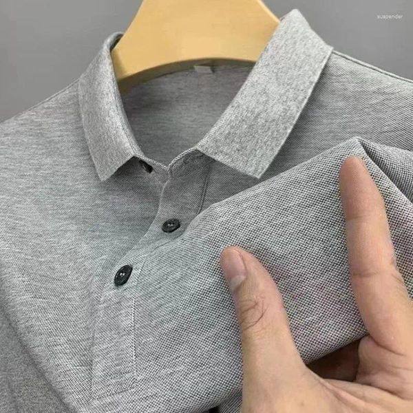 Polo da uomo Polo estiva a maniche corte da uomo Design ampio Senso della moda Tendenza Bottoni solidi Patchwork Business Casual Versatile Top con risvolto