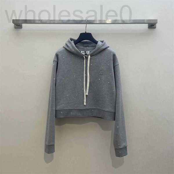 Kadın Hoodies Sweatshirts Tasarımcı 2024 Erken Bahar Yeni Çağını İndirir Kız Tarzı Mektubu Çıkartma Nakış Sıcak Elmas Kapüşonlu Drawstring Pullover Sweater WV9W