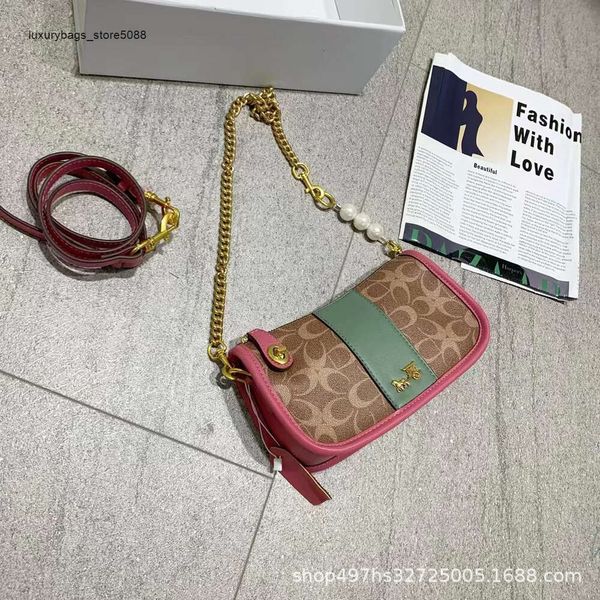 Fabrikverkauf Neue Heiße Designer-Handtasche Hong Kong Echtes Leder Kettentasche Damen Sommer High-End und Unterarmschulter