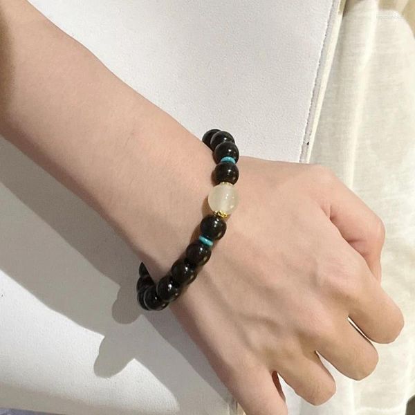 Bracciale giocattolo culturale e artistico minimalista in legno di sandalo nero avvolto attorno alle dita con manico morbido e un unico anello