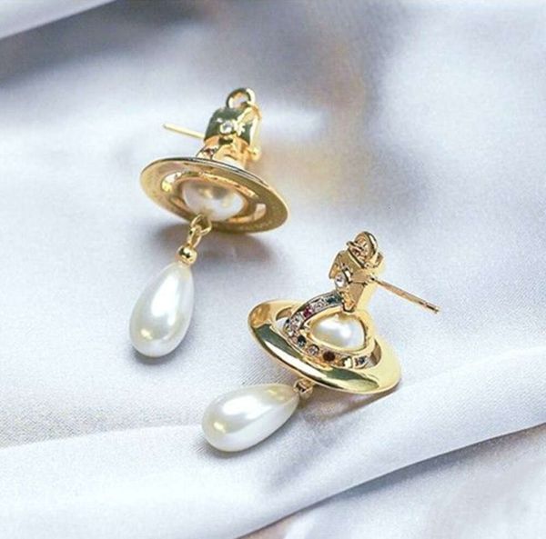 Orecchini di perle di design Planet Pendenti con perle di Saturno Orecchini da donna in stile lusso leggero con gioiello originale 146546