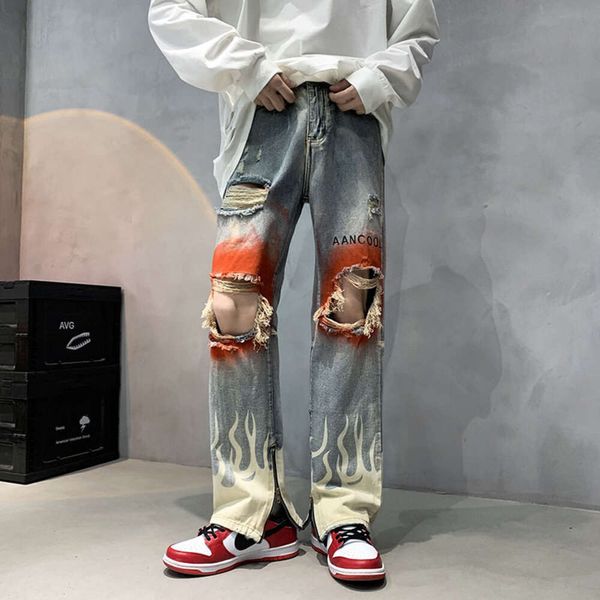 Jeans stampati a spruzzo con fori invecchiati, jeans alla moda da uomo di High Street di Instagram con un senso del design di lusso e pantaloni da mendicante