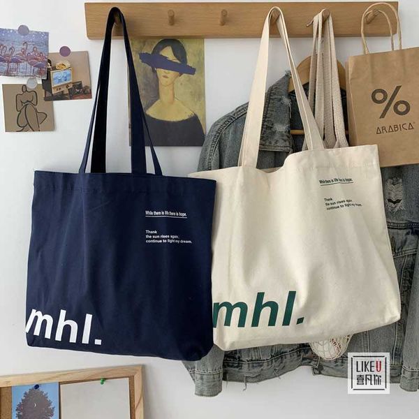 Versatile versione coreana Stile Instagram Minimalista Borsa di tela casual Classe per studenti Borsa di tela a spalla singola con lettera di grande capacità 240315