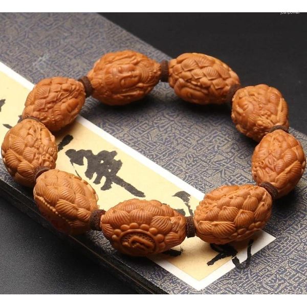 Prodotto in filo di noce scolpito a mano sul braccialetto portatile del trono di loto Guanyin in pietra uliva Hu con certificato